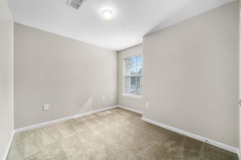 Carpeted Bedroom With Large Window - Cedar Floor Plan